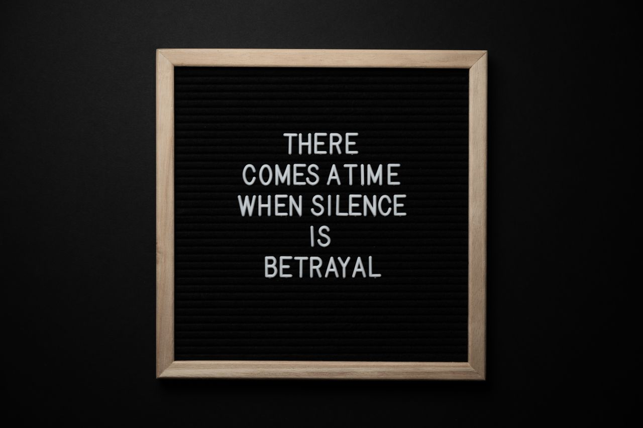 Crafting Captivating Headlines: Your awesome post title goes here From above chalkboard with THERE COMES A TIME WHEN SILENCE IS BETRAYAL inscription on black background