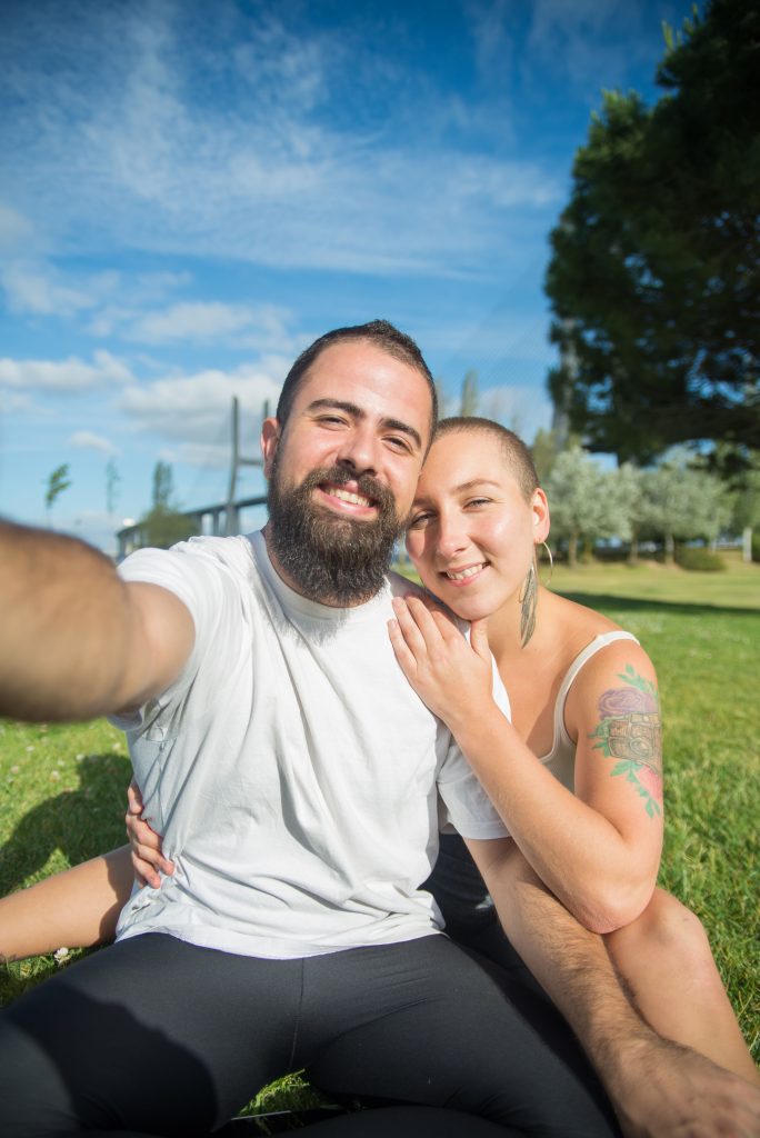 pexels photo 8713858 8713858 Smiling couple enjoying a sunny day in the park, capturing a selfie together